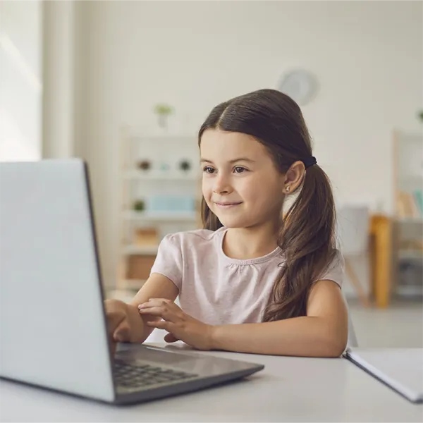 Kindergarten child participating in virtual learning.